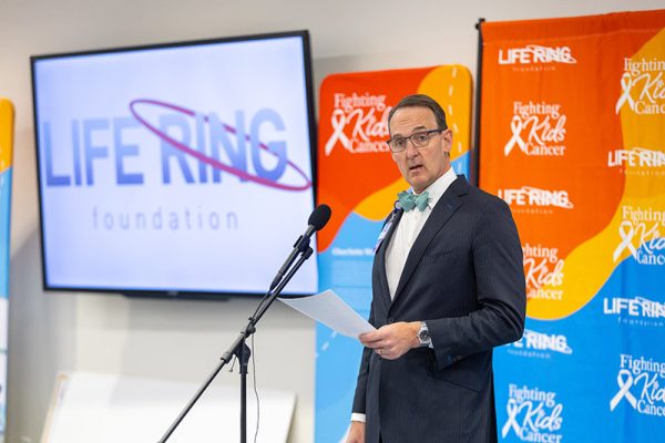 Carilion Clinic's Dr. Andrew Herman, department chair of pediatrics, and Kelly Woolwine, Life Ring Foundation Co-Founder, make remarks during the Life Ring Foundation check presentation and announcement at Carilion Children's Tanglewood on Tuesday, Dec. 2, 2025, in Roanoke, Virginia.